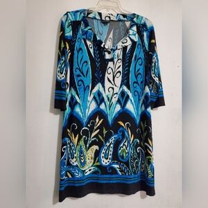 Women's tunic style dress featuring a vibrant, multi-color